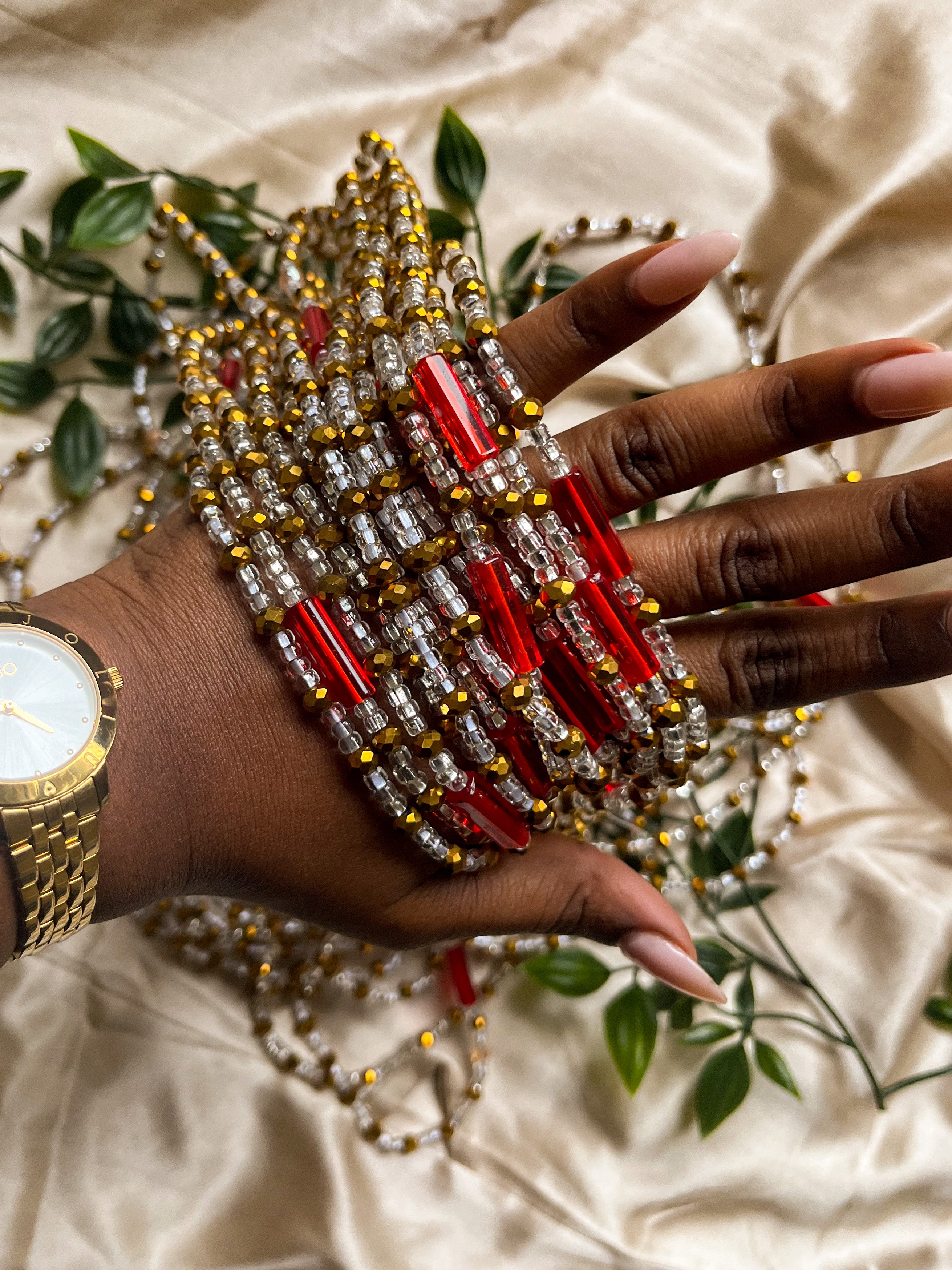 red, gold and silver african waist beads. Top view