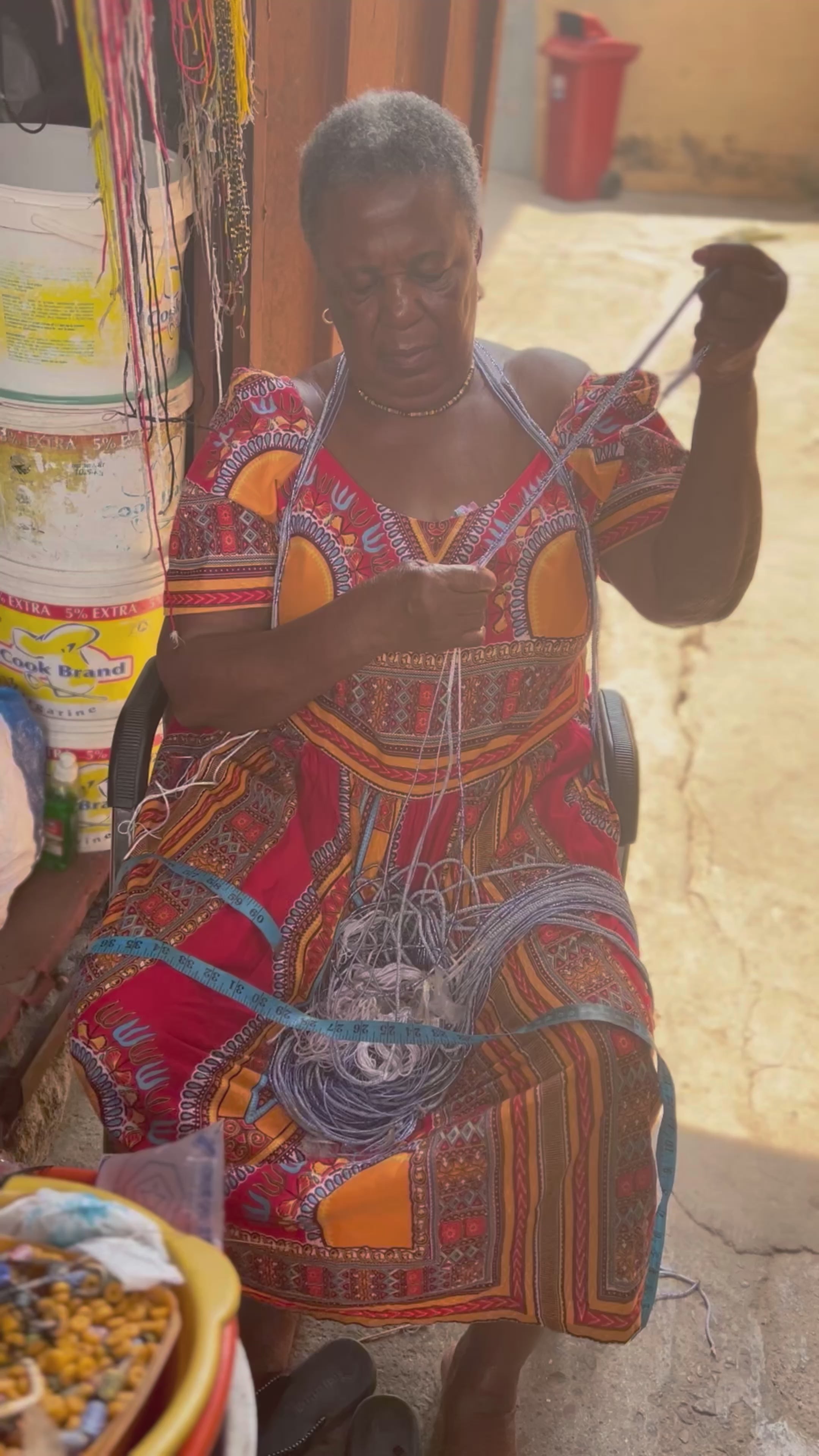 Load video: waist beads being made in Ghana
