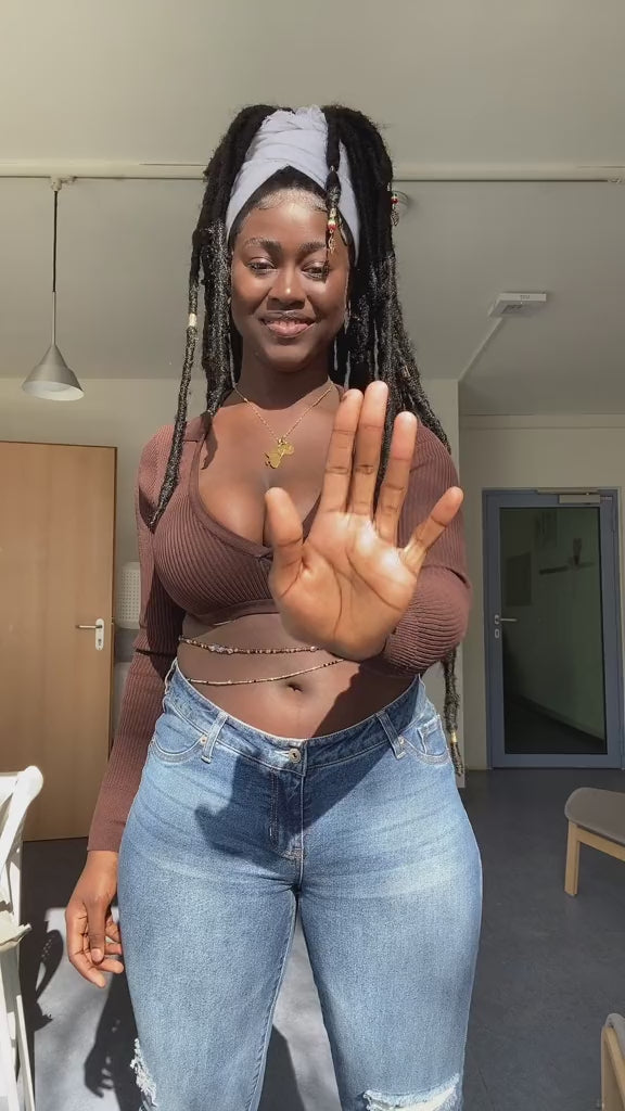 Load video: african girl dancing with african waist beads